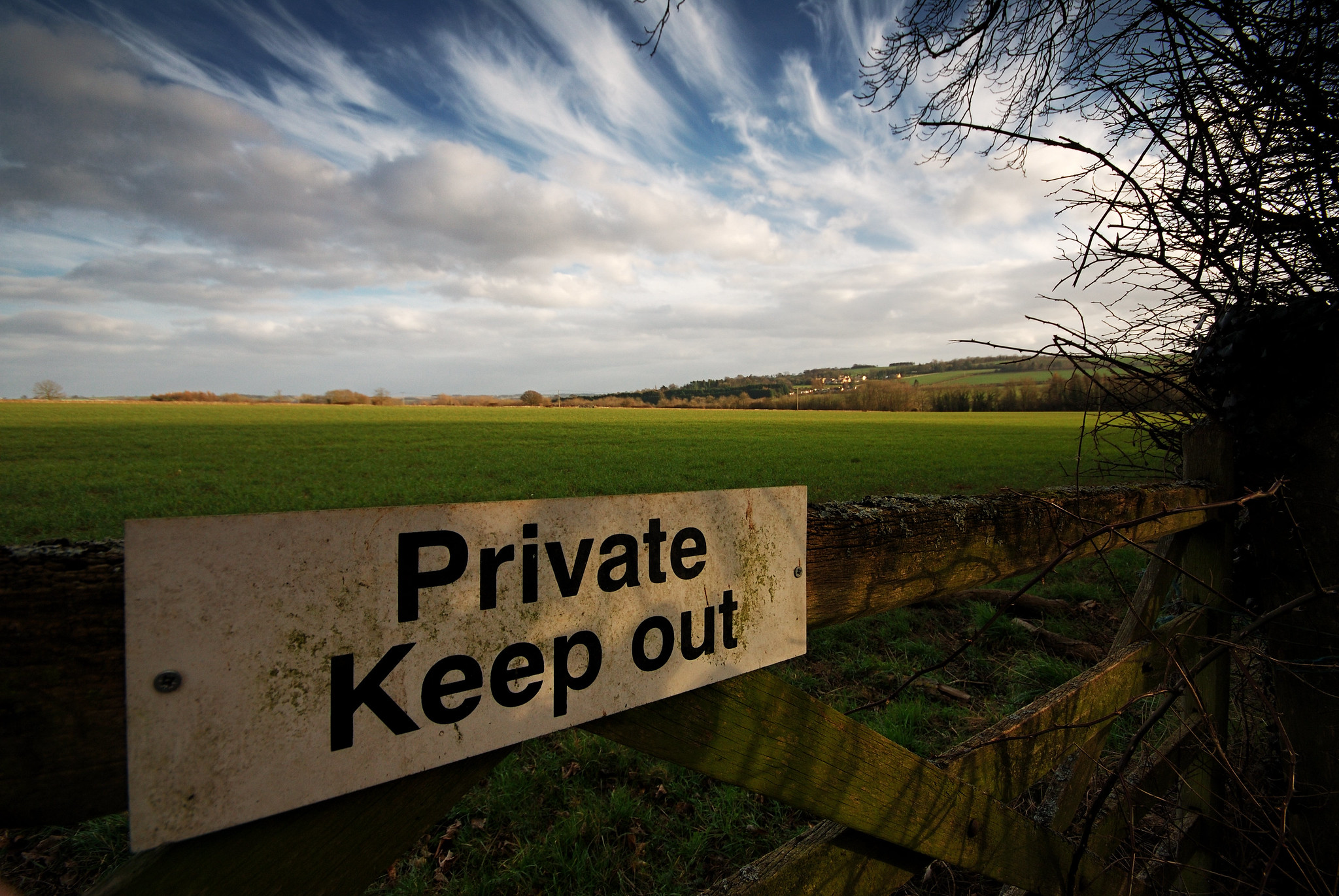 Sign saying 'Private Keep out' by a field in England